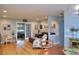 Open concept living area with hardwood floors, and a view into an adjacent room at 28 Glenald Nw Way, Atlanta, GA 30327