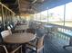 Outdoor patio with tables and chairs overlooking water at 28 Glenald Nw Way, Atlanta, GA 30327