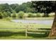 Serene pond with geese and wooden fence at 28 Glenald Nw Way, Atlanta, GA 30327