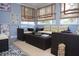 Bright sunroom with wicker furniture and patterned flooring at 28 Glenald Nw Way, Atlanta, GA 30327