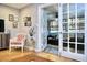 Charming sunroom with wicker furniture and French doors at 28 Glenald Nw Way, Atlanta, GA 30327