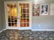 Sunroom with French doors and patterned tile floor at 28 Glenald Nw Way, Atlanta, GA 30327