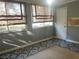 Sunroom with patterned tile floor and large windows at 28 Glenald Nw Way, Atlanta, GA 30327