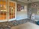 Sunroom with hardwood floors, French doors, and decorative wall art at 28 Glenald Nw Way, Atlanta, GA 30327