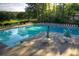 Community pool with plenty of lounge chairs at 28 Glenald Nw Way, Atlanta, GA 30327