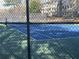 Blue tennis court with chain link fence at 28 Glenald Nw Way, Atlanta, GA 30327