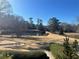 Tennis courts with trees and a golf course in the background at 28 Glenald Nw Way, Atlanta, GA 30327