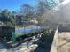 Tennis court with surrounding trees and landscaping at 28 Glenald Nw Way, Atlanta, GA 30327