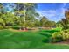 Tennis courts nestled in a lush, tree-lined landscape at 28 Glenald Nw Way, Atlanta, GA 30327