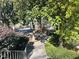 Landscaped walkway leading through lush trees at 28 Glenald Nw Way, Atlanta, GA 30327