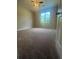 Well-lit bedroom with ceiling fan and carpet at 3576 Mill Creek Sw Dr, Smyrna, GA 30082