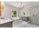 Spa-like bathroom with freestanding tub, marble flooring, and walk-in shower at 500 Westover Nw Dr, Atlanta, GA 30305