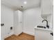 Laundry Room with sink and built-in storage at 500 Westover Nw Dr, Atlanta, GA 30305