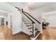 Elegant hardwood staircase in a bright and spacious entryway at 500 Westover Nw Dr, Atlanta, GA 30305