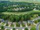 Aerial view of homes and community with lush green landscape at 156 Vine Creek Dr, Acworth, GA 30101