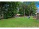 Large backyard with playground and firepit at 156 Vine Creek Dr, Acworth, GA 30101