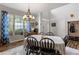 Bright dining room with hardwood floors and stylish chandelier at 156 Vine Creek Dr, Acworth, GA 30101