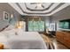 Main bedroom with tray ceiling, hardwood floors, and sitting area at 156 Vine Creek Dr, Acworth, GA 30101