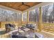 Covered porch with wooden ceiling, comfortable seating and wooded views at 160 Cedarwood Ln, Roswell, GA 30075