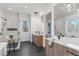 Bathroom featuring a glass enclosed shower, tub, and double vanities with modern lighting at 160 Cedarwood Ln, Roswell, GA 30075