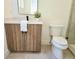 Modern bathroom with wood vanity, sleek fixtures, and tiled shower at 160 Cedarwood Ln, Roswell, GA 30075