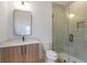 Contemporary bathroom with wood vanity, shower, and gray tile at 160 Cedarwood Ln, Roswell, GA 30075