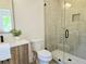 Bathroom featuring modern fixtures and a tiled walk-in shower at 160 Cedarwood Ln, Roswell, GA 30075