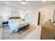 Serene bedroom with a soft rug, wood headboard and bench seating at 160 Cedarwood Ln, Roswell, GA 30075