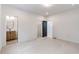 Bright bedroom featuring wood-toned vanity, carpet, and a walk-in closet at 160 Cedarwood Ln, Roswell, GA 30075