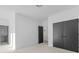 Neutral bedroom with gray carpet, white walls, and access to ensuite bathroom at 160 Cedarwood Ln, Roswell, GA 30075