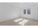 Bright bedroom with plush carpet, a large window, and ample space for furniture at 160 Cedarwood Ln, Roswell, GA 30075