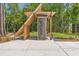 Modern community bike rack with unique architectural design and adjacent grassy areas at 160 Cedarwood Ln, Roswell, GA 30075