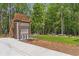 A convenient bike rack area, next to the fire pit and seating in the grassy common space at 160 Cedarwood Ln, Roswell, GA 30075