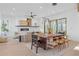 Open concept dining room with wood table and modern lighting at 160 Cedarwood Ln, Roswell, GA 30075