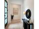 Bright entryway with light hardwood floors, a black console table, and modern art at 160 Cedarwood Ln, Roswell, GA 30075