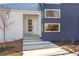 Modern entryway with a glass door and concrete walkway at 160 Cedarwood Ln, Roswell, GA 30075