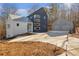 Contemporary home with metal roof and two-car detached garage at 160 Cedarwood Ln, Roswell, GA 30075