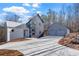 Modern home with attached two-car garage and expansive driveway at 160 Cedarwood Ln, Roswell, GA 30075