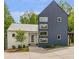 Stylish modern home showcasing unique architectural details and thoughtful landscaping at 160 Cedarwood Ln, Roswell, GA 30075
