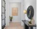 Bright foyer with clean lines featuring light-colored walls, hardwood floors, and modern decorative elements at 160 Cedarwood Ln, Roswell, GA 30075
