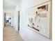 Bright hallway with hardwood floors, modern art, and bedroom view at 160 Cedarwood Ln, Roswell, GA 30075