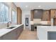 Modern kitchen with gray cabinets, white quartz countertops and a large island at 160 Cedarwood Ln, Roswell, GA 30075