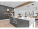 Bright kitchen with floating shelves, stainless steel appliances, large island, and adjacent dining area at 160 Cedarwood Ln, Roswell, GA 30075