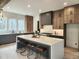 Modern kitchen with wood and gray cabinets and a large island at 160 Cedarwood Ln, Roswell, GA 30075