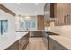 Modern kitchen with stainless steel appliances and gray and wood cabinetry at 160 Cedarwood Ln, Roswell, GA 30075