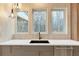 Modern kitchen with white quartz countertops and a farmhouse sink at 160 Cedarwood Ln, Roswell, GA 30075