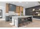 Modern kitchen with island, gray cabinets, and wood accents at 160 Cedarwood Ln, Roswell, GA 30075