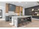 Kitchen with custom cabinets, quartz countertops, stainless steel appliances, and floating shelves at 160 Cedarwood Ln, Roswell, GA 30075
