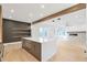 Open concept kitchen island with white quartz countertops and gray cabinetry at 160 Cedarwood Ln, Roswell, GA 30075