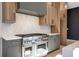 Modern kitchen with a stainless steel range and white quartz countertops at 160 Cedarwood Ln, Roswell, GA 30075